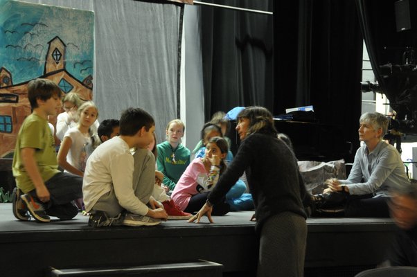 The Springs School Opera Company gathers around after a rehearsal of its original production, "Dogs Don't Talk," at Guild Hall in East Hampton. KYRIL BROMLEY