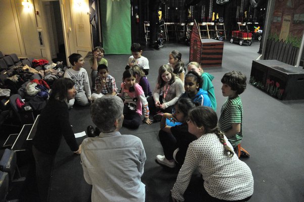 The Springs School Opera Company gathers around after a rehearsal of its original production, "Dogs Don't Talk," at Guild Hall in East Hampton. KYRIL BROMLEY