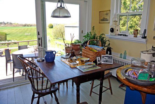 The kitchen table with a view to the back deck.