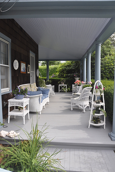 Virginia Connolly keeps her porch in line with her garden by utilizing potted plants. MICHELLE TRAURING