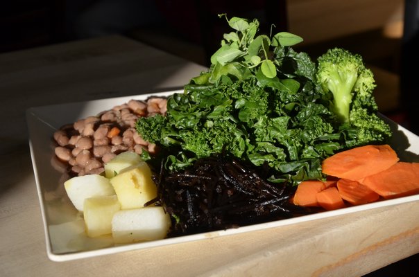 A vegan dish, created by Privisons Chef Dennis MacNeil, called "Baby Buddha," containing brown rice, beans, steamed vegetables, sea vegetables. SHAYE WEAVER