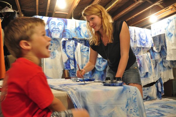 Aubrey Roemer will paint 400 portraits of Montauk locals by summer's end. MICHELLE TRAURING