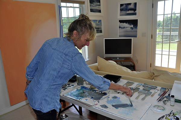 Artist Janet Jennings mixes oils in her studio in Amagansett. MICHELLE TRAURING