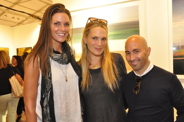 Aimee Early, Molly Sims and Dan Scotti at ArtHamptons. MICHELLE TRAURING