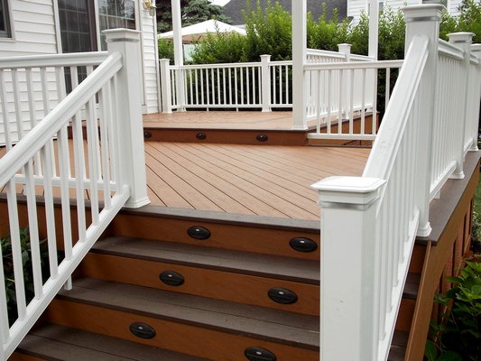 Stair and post lights help extend the life of a deck into the winter. COURTESY EZ-DECKS