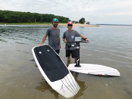 William Graham and Kieran McGuire, founders of Elevated East, riding their eFoil boards in North West Harbor on Monday morning.   ELIZABETH VESPE