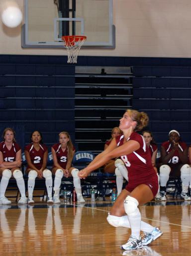 Shaina Preiss digs a ball.   DREW BUDD