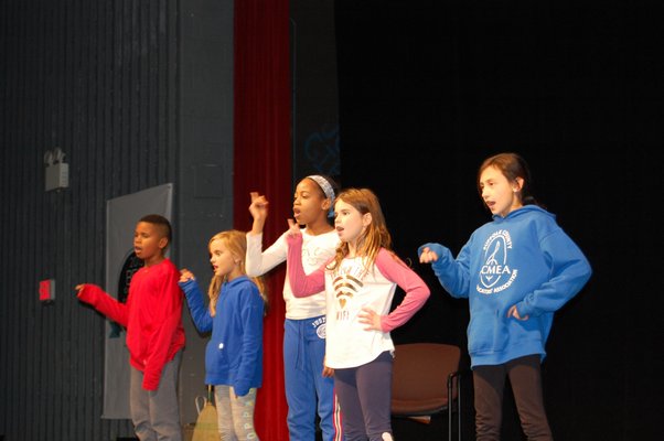 Members of the cast of the Springs School Opera rehearsing in the auditorium of the East Hampton High School. JON WINKLER