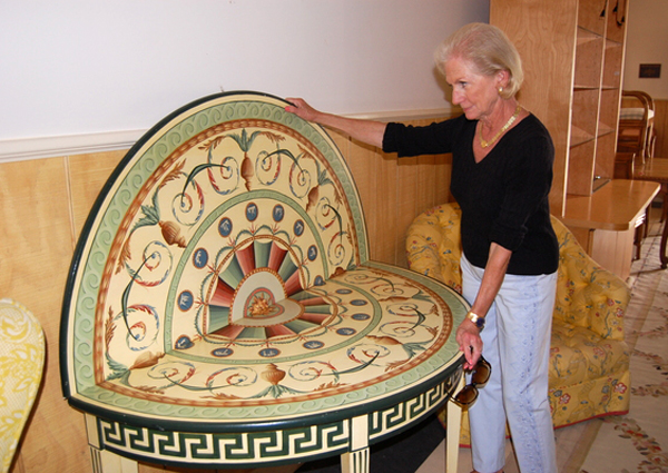 Ann Grimm shows off a table the will be for sale at the Decorators-Designers-Dealers show, to be held on Saturday, June 5. JESSICA DINAPOLI