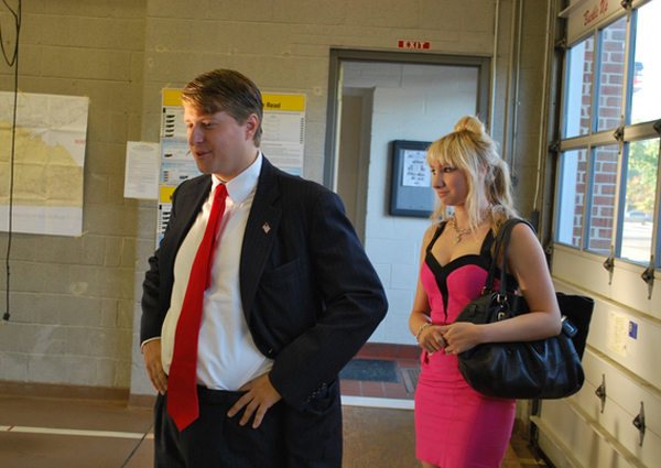Chris Cox and his fiancee, Andrea Catsimatidis, arrive at the polling station at the Westhampton Beach Fire Department headquarters on Tuesday morning.<br>Photo by Will James
