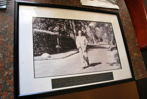 An undated photograph of P.G. Wodehouse that hangs at Trackhouse Cafe in Speonk. The caption says it shows Mr. Wodehouse walking down Basket Neck Lane on his way to the post office with a manuscript.   WILL JAMES