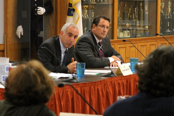 Suffolk County Legislator Jay Schneiderman, left, and challenger, Chris Nuzzi, debate on Monday. KYRIL BROMLEY