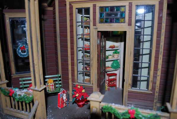 Christmas gifts left at the doorstep of the doll house LAURA WEIR