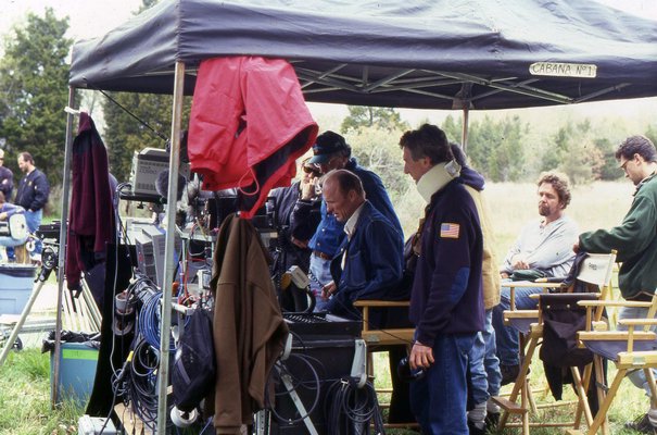 With members of his production team, Ed Harris views the rushes at the end of a film shooting in Springs. HELEN HARRISON
