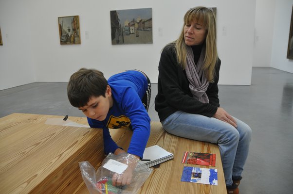 J.P. Carrello draws while his mother, Adrian, looks on. MICHELLE TRAURING