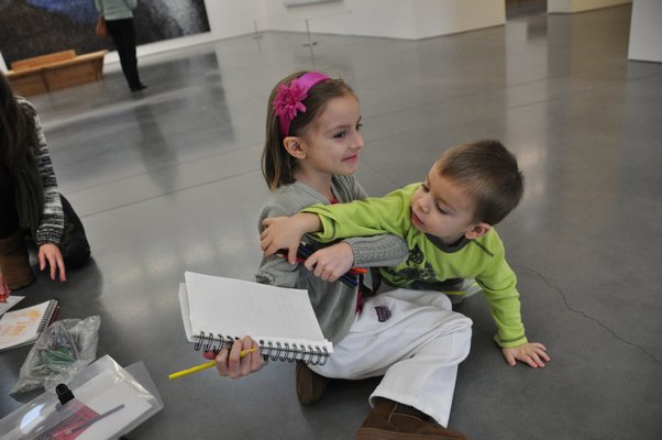 Adriana and Marc-Andre Tapfer fight over colored pencils. MICHELLE TRAURING