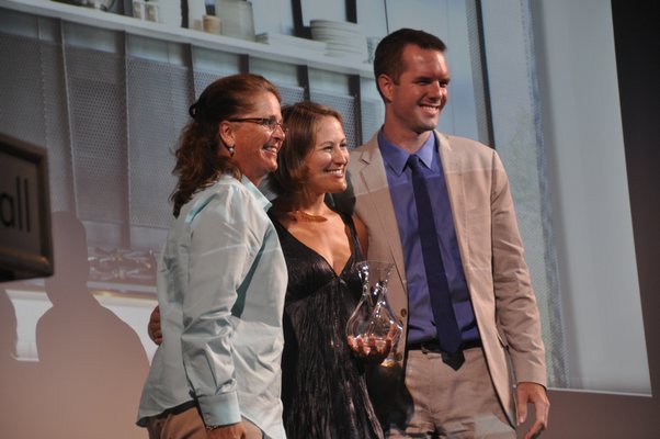 Dottie Simons, left, presents Katherine Dalene Weil and Aaron Weil of Bates Masi + Architects with the award for Innovation in Kitchen Design. MICHELLE TRAURING