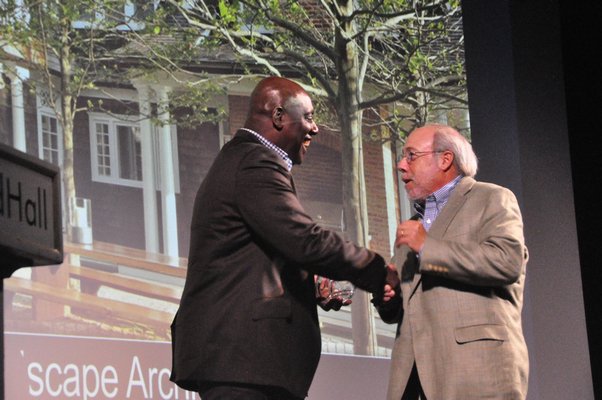 Dennis Howard, left, presents Edmund Hollander of Edmund Hollander Landscape Architect with the award for Innovation in Garden Design. MICHELLE TRAURING