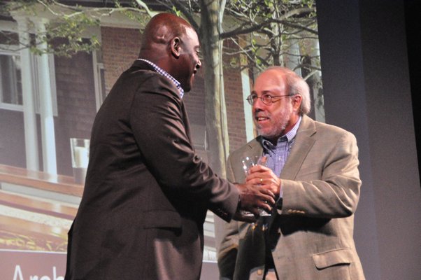 Dennis Howard, left, presents Edmund Hollander of Edmund Hollander Landscape Architect with the award for Innovation in Garden Design. MICHELLE TRAURING