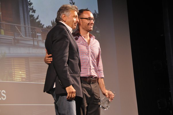 John Taranto, left, presents a representative from Stelle Lomont Rouhani Architects with the award for Innovation in Architecture Design. MICHELLE TRAURING