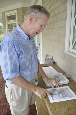 Ken Gemes reviews his plan for the Hampton Designer Showhouse's back patio. MICHELLE TRAURING