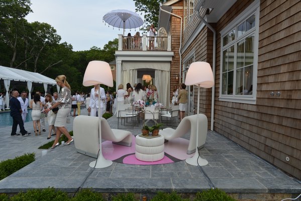 An outdoor lounge by Eugenia Au Kim The Design Studio at Holiday House Hamptons. ALEX GOETZFRIED