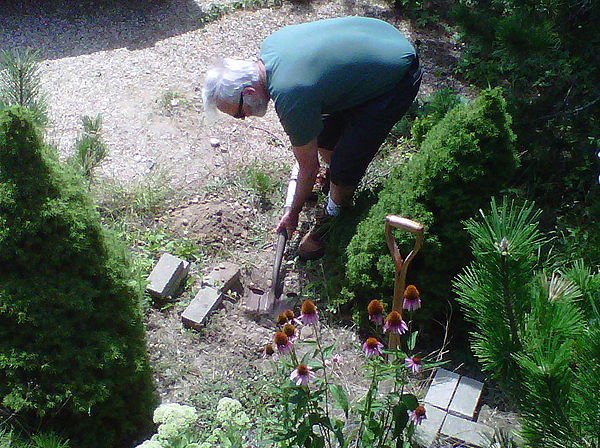 Warren Schultz at work in the garden.   LAUREN EZERSKY