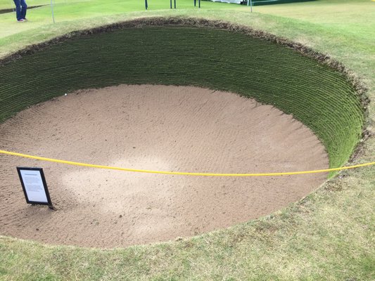 Sand traps or bunkers, called  "pots" in Scotland and cruel to chip out of. MARSHALL WATSON