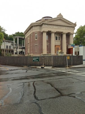 A front view of exterior restoration of the John Jermain Memorial Library showing the steel framework for the addition attached at rear. ANNE SURCHIN