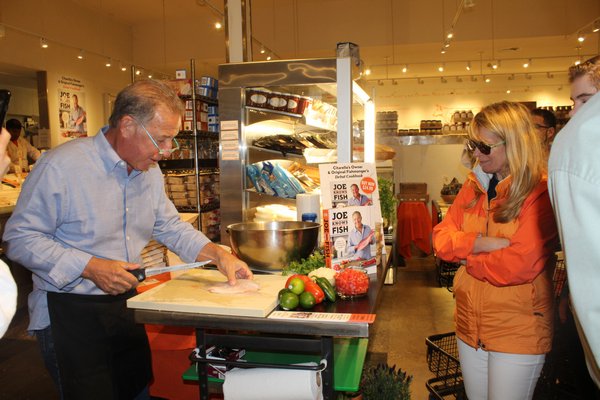 Customers enjoyed watching chef Joe Gurerra's presentation and asking him questions about the recipe.  JULIA HALSEY