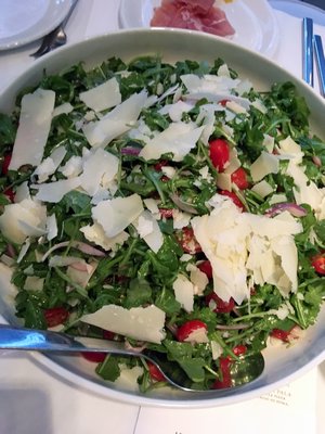 Arugula, onion, tomato salad with Parmesan cheese.  JANEEN SARLIN