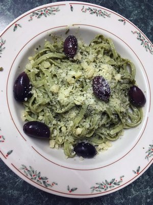 Spinach pasta with pea pesto and olives.