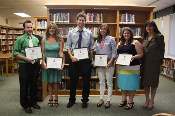Sag Harbor School District employees Anthony Chase Mallia, Anita LaGrassa, Jonathan Schwartz, Lacey Price, Margaret Motto and Claire Michelle Viola (left to right), all were honored on at the school board meeting on Monday, June 17. Brandon B. Quinn