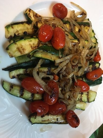 Grilled zucchini with onions and blistered tomatoes. JANEEN SARLIN