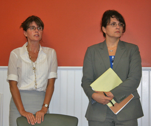 Town Councilwoman Anna Throne-Holst and Freda Eisenberg, the assistant town planning and development administrator, discuss plans for affordable housing in Flanders Monday night at a FRNCA meeting.