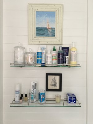 Displaying amenities on glass shelves is not only practical but can look beautiful. MARSHALL WATSON