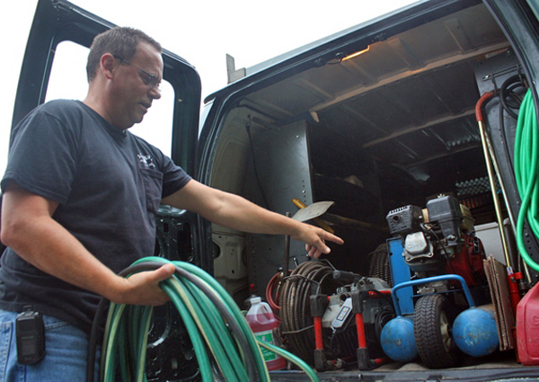 Dave Alberti, a master plumber at J.P. Mulvey in Hampton Bays, shows off some of the company's winterization equipment.