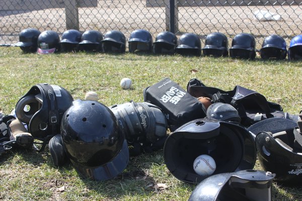 March 13 -- Helmets and equipment at the Iron Point Park baseball field in Flanders. Flanders Little League is disbanded after 40 years due to a lack of enrollment.
