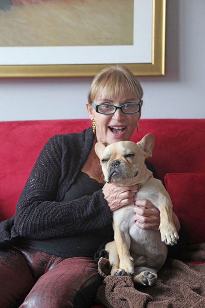 Phyllis Elliott poses with her French bulldog, Marcel, star of The Corcoran Group's first-ever live-action commercial. COURTESY PHYLLIS ELLIOTT