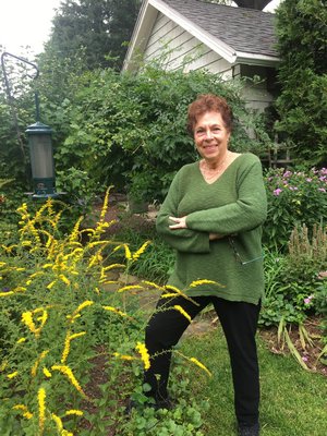 Susan Skoorka and some autumn-blooming goldenrod. LISA DAFFY