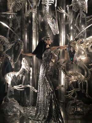Diamond encrusted dinosaur skeletons surround a sequined Cleopatra in a Bergdorf Goodman window. MARSHALL WATSON