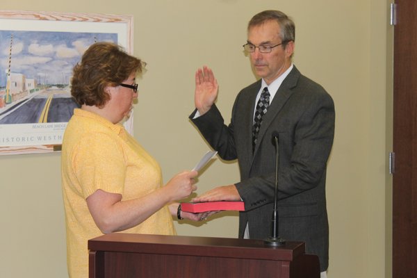 Westhampton Beach Village Trustee Charlie Palmer is sworn into office on Monday night. KYLE CAMPBELL