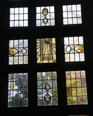The Four Winds and Time are illuminated by the sun in stained glass windows. KYRIL BROMLEY