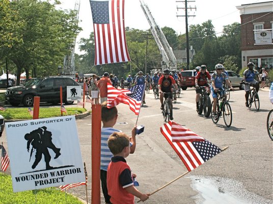 July 24: Soldiers, veterans and supporters take part in the ninth annual Soldier Ride, taking to bikes for a 30-mile roundtrip from Amagansett to Sag Harbor and back. The event raised money for the Wounded Warrior Project.