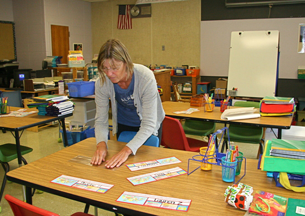 Tracey Frazier, a fifth grade teacher at the Springs School, prepares her classroom for students.