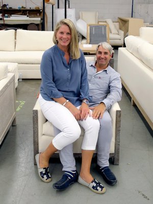 Jennifer Mabley and Austin Handler seated on  The Flying Point Club Chai at the factory. COURTESY MABLEY HANDLER INTERIOR DESIGN