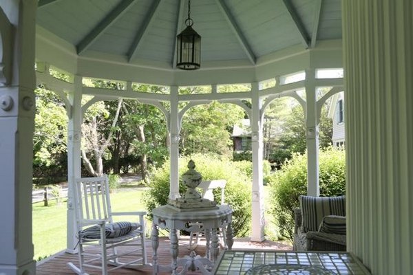 This porch, which once looked out directly to Quantuck Bay, mirrors the conical, planked ceiling of the bedroom between the second and third floors of the McBrides' Quiogue residence. LB LOWNES FOR JENNY LANDEY PRODUCTIONS