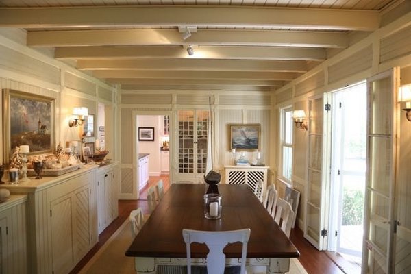 The dining room of the McBride home in Quiogue has wide doors on the side. Cross-ventilation was a key component of the time, and the home is, as-of-yet not air-conditioned. LB LOWNES FOR JENNY LANDEY PRODUCTIONS