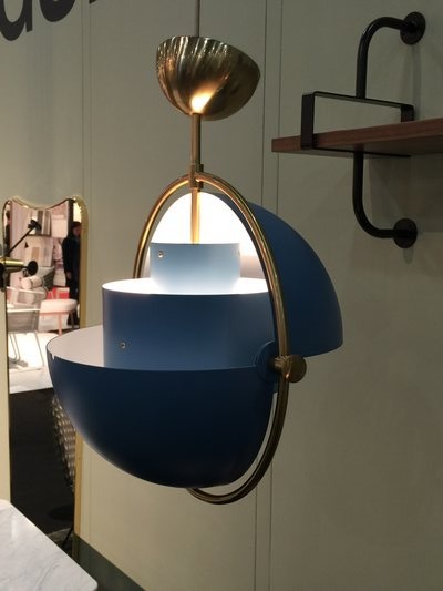 Gubi introduced a blue-white globe of flexible shades framed in brass that fit perfectly into a seaside kitchen. MARSHALL WATSON