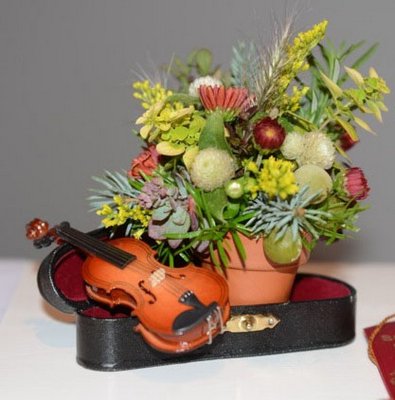 The Southampton Garden Club's Best in Show Tri-Color Cup went to Laurie Carson for her miniature entry in the class, "September Song."